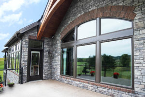 View of specialty shape windows from the exterior of a home