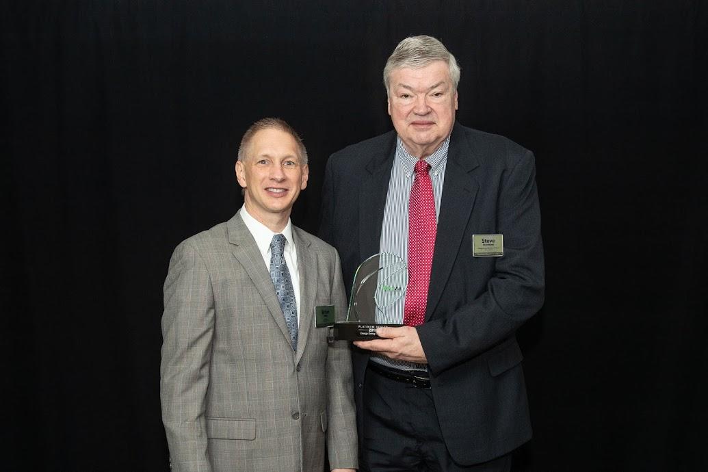 2 men winning an award